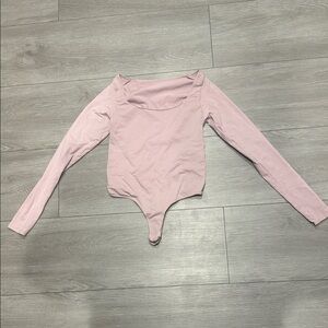 SKIMS Long Sleeve Scoop Neck Bodysuit in Light Pink
